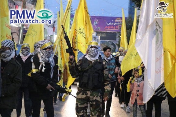 Armed masked fighters march at Fatah rally in Salfit 