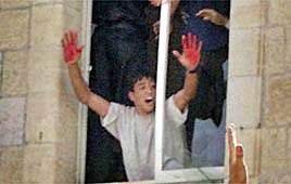 Picture of terrorist with bloody hands from the Ramallah lynch